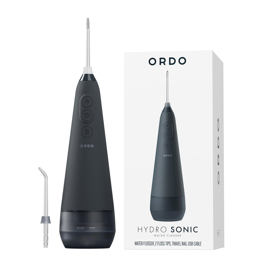 Customer using a Hydro Sonic water flosser